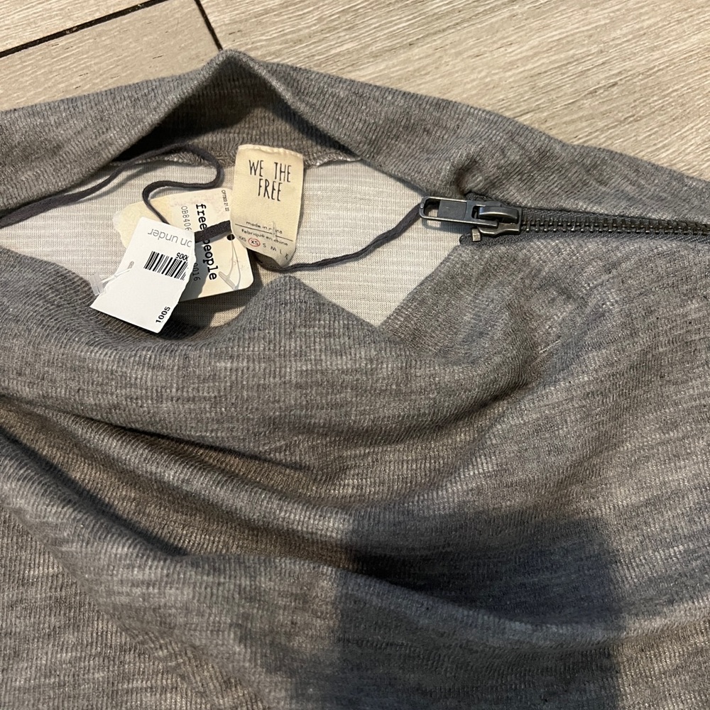 “We the free” NWT gray color with tiny version of bat wings